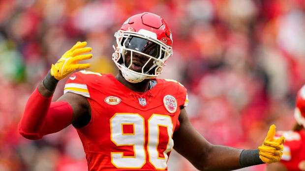 Dec 25, 2023; Kansas City, Missouri, USA; Kansas City Chiefs defensive end Charles Omenihu (90) rallies the crowd during the second half against the Las Vegas Raiders at GEHA Field at Arrowhead Stadium. Mandatory Credit: Jay Biggerstaff-USA TODAY Sports  